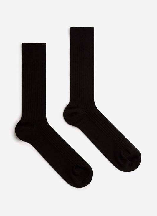 A pair of black Percival Loafer Dress Socks, showing their ribbed texture, laid flat against a white background.