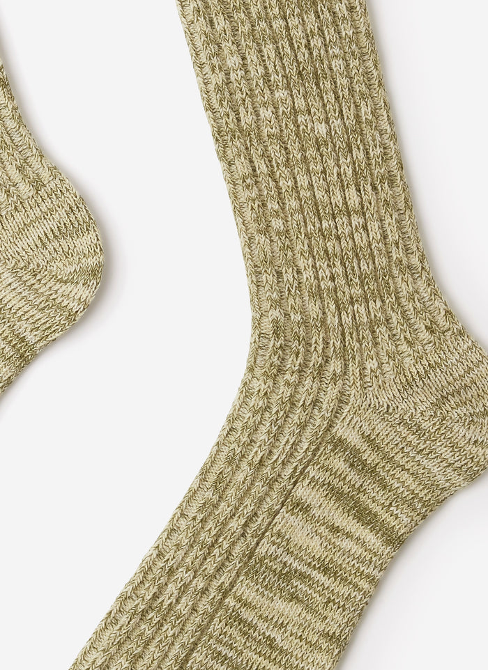 A close-up of the Percival Marl Socks in fern green, highlighting the detailed texture of the ribbed cotton-blend knit.