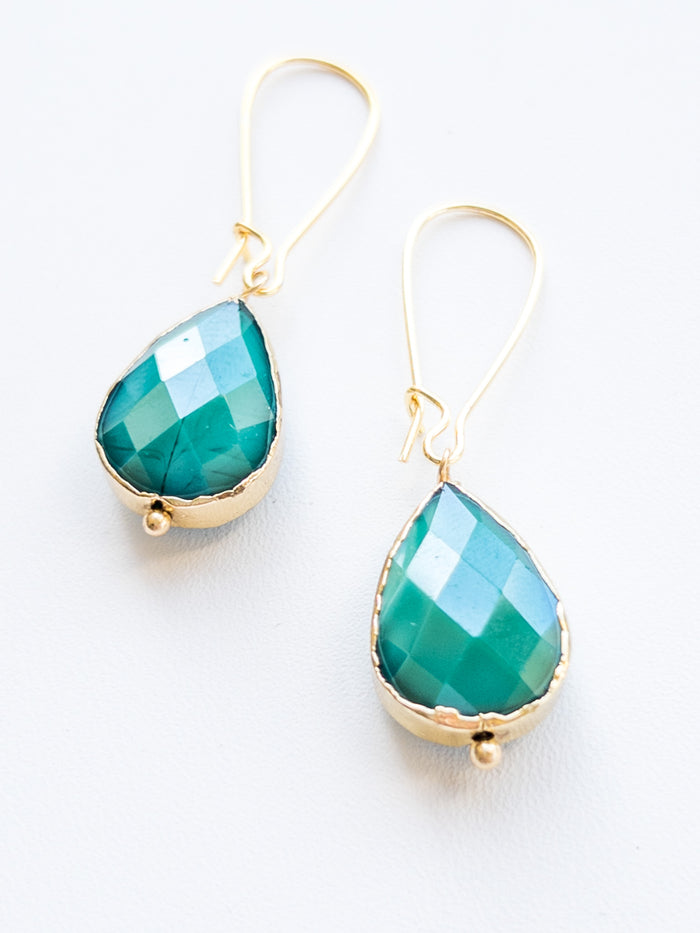 Emerald green and gold dangle tear drop handmade nickel free earrings flat lay