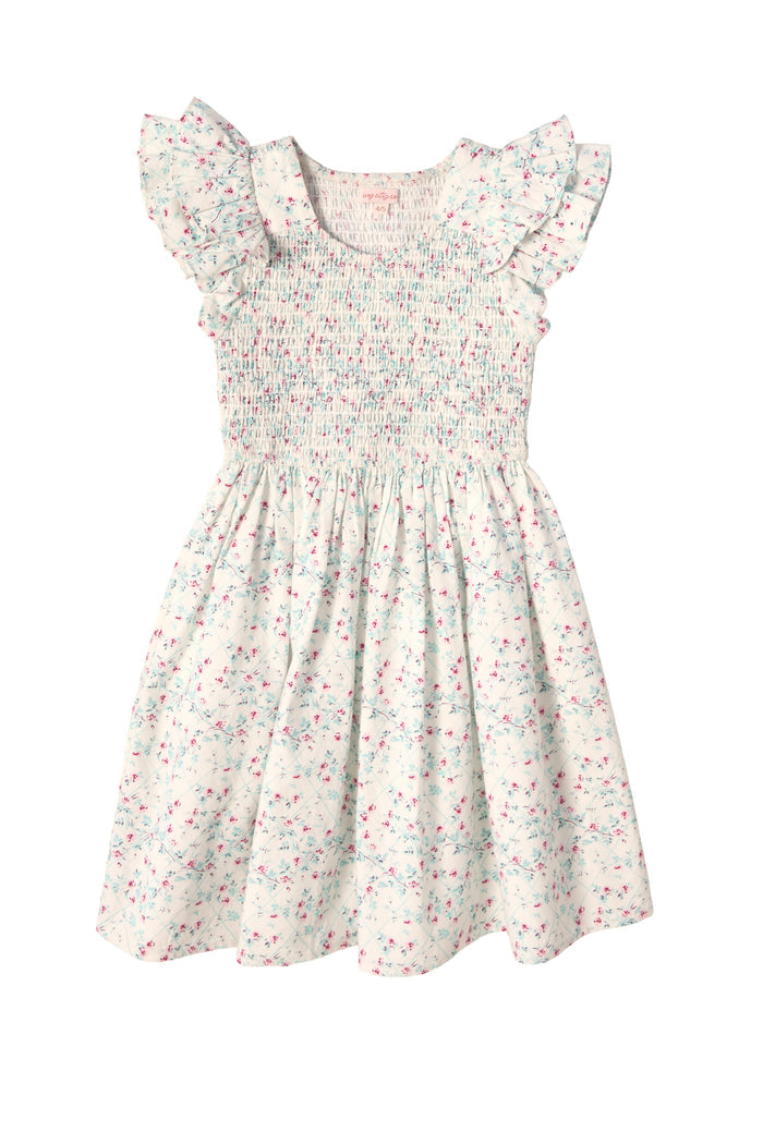 The Mini Hattie Dress in Pansy Trellis by Ivy City Co features a white cotton design with pastel pink and blue floral print, ruffled cap sleeves, smocked bodice, and a softly gathered skirt—perfect for spring.
