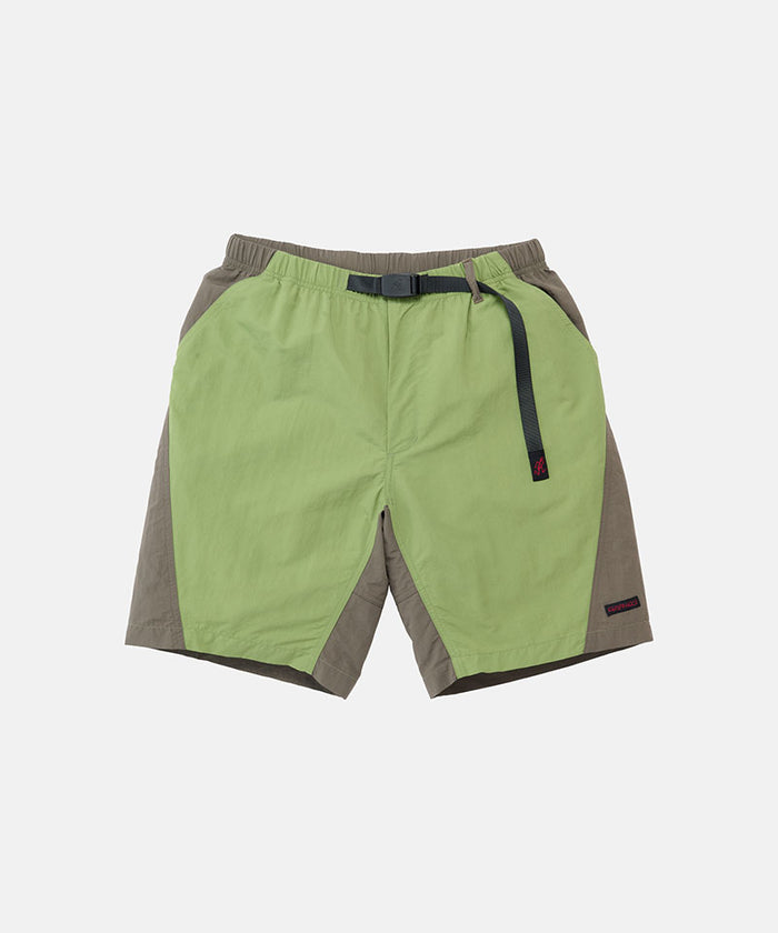 Jade green Gramicci Nylon Block Shorts with a belt against a light-tone background.