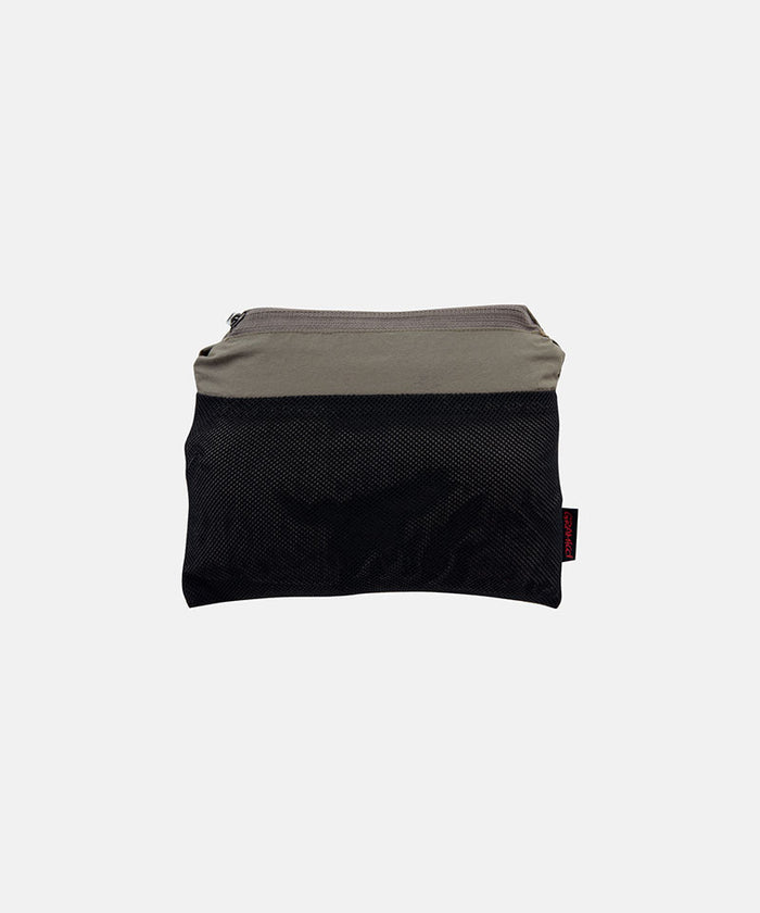 Jade green Gramicci Nylon Block Shorts inside carrying pouch against a light-tone background.