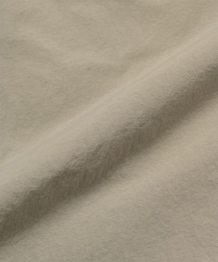Milk tea colored colored Gramicci Nylon Cliff Short fabric swatch.