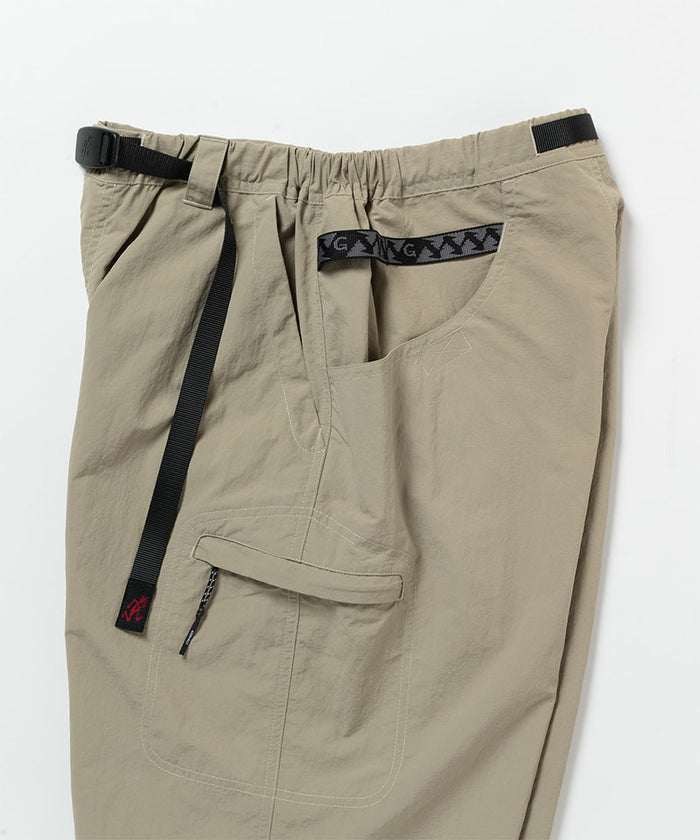 Close-up view of milk tea colored Gramicci Nylon Cliff Short on a light-tone background.