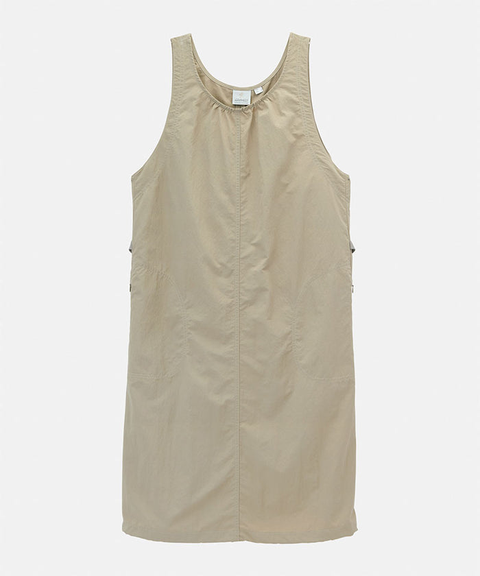 Milk tea colored Gramicci Nylon Dress against a light-tone background.