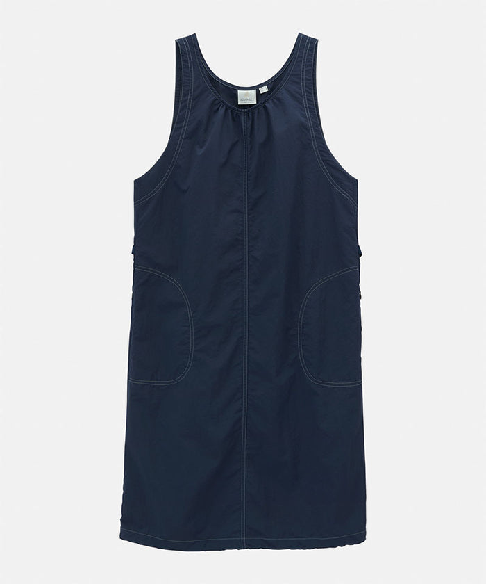 British navy colored Gramicci Nylon Dress against a light-tone background.