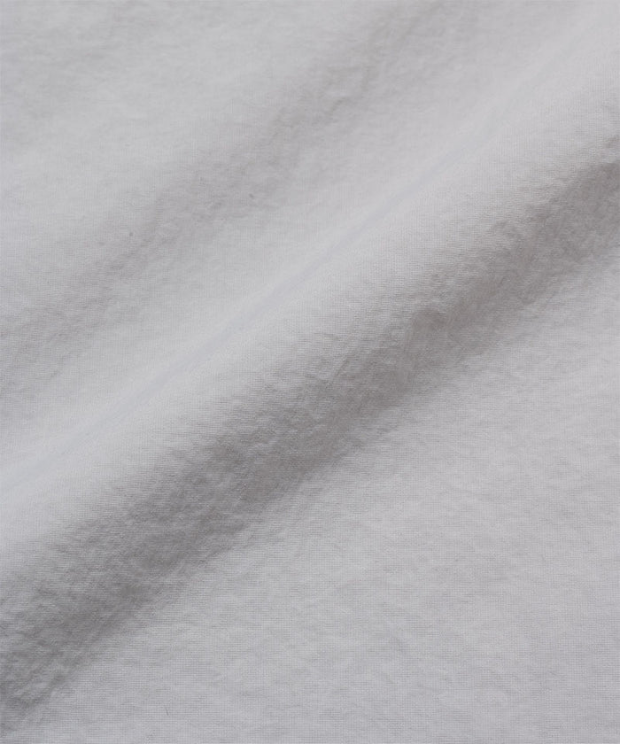 Gramicci ecru colored Nylon Utility Skirt fabric swatch.