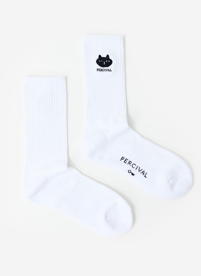 The white Perci Loaf Embroidered Socks from Percival, laid flat to show the black cat logo and branding on the sole.