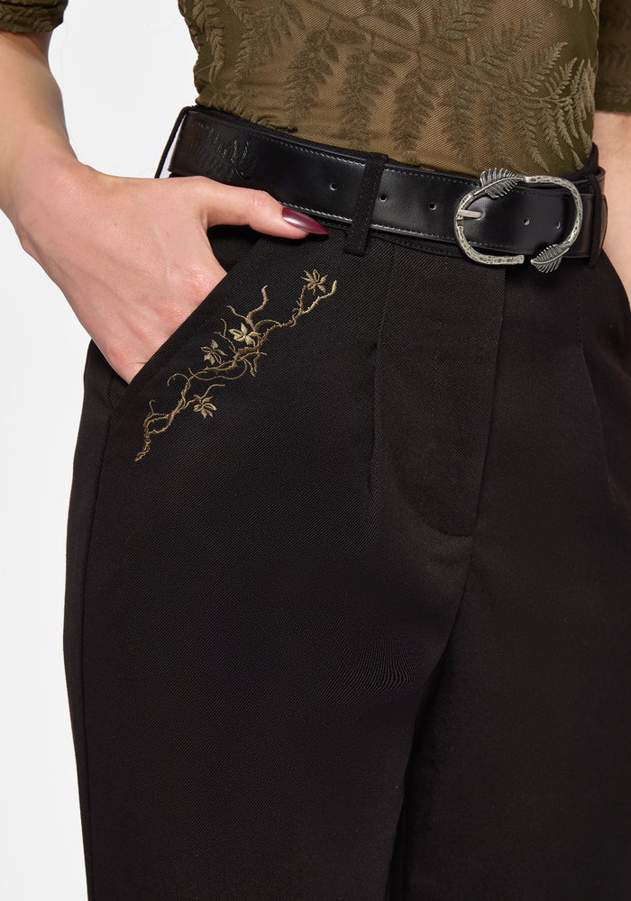Black pants with floral green embroidery
