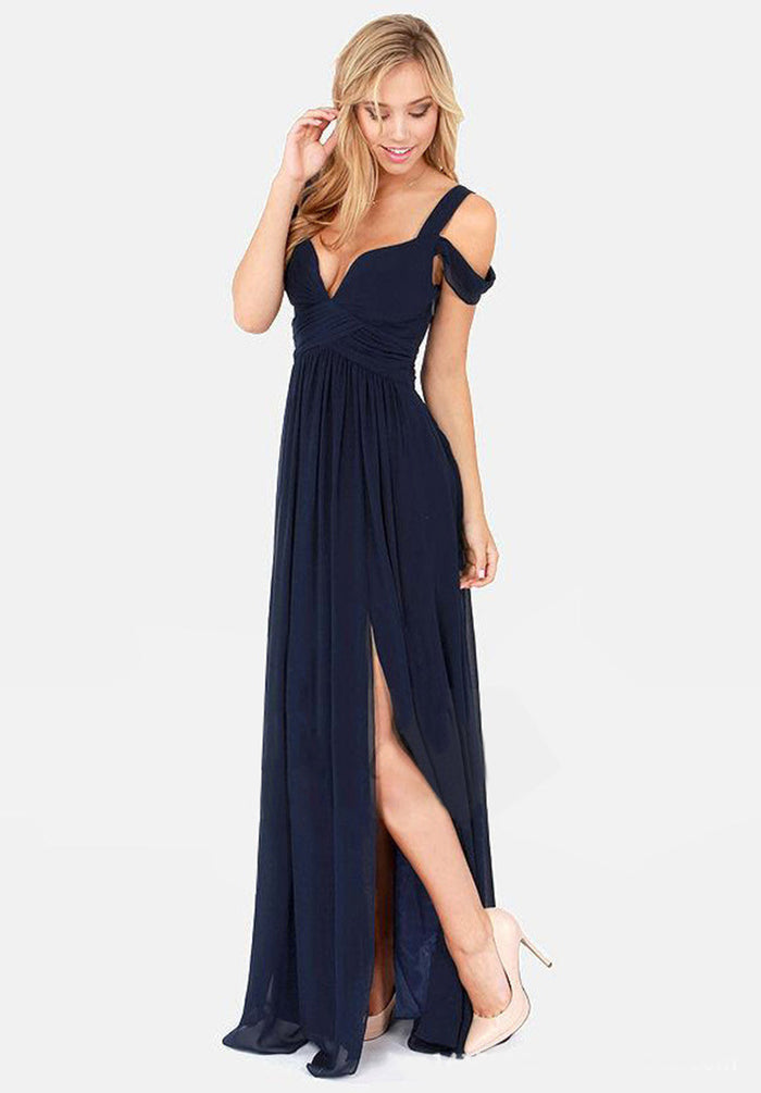 Pleated maxi dress shown in motion to highlight the floor-length hem, pleated detail and flowing Grecian-inspired silhouette.