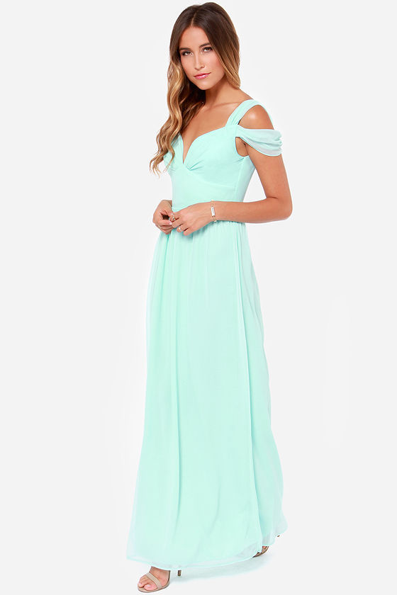 Outfit view of the Grecian dress with a natural waist, short sleeves and floor-length pleated styling for product comparison.
