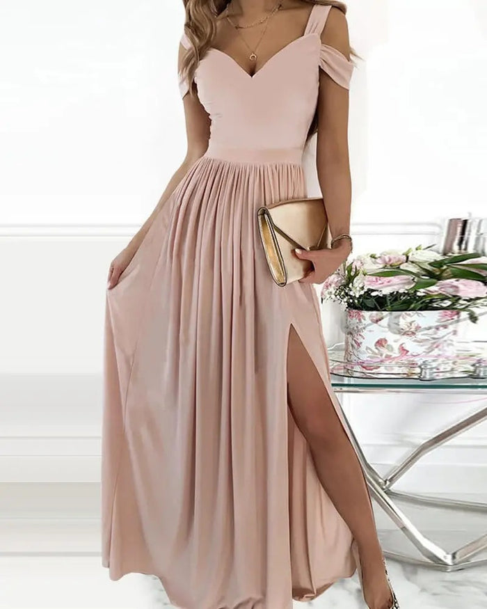 Floor-length dress detail showing the drape and pleated texture for a closer look at the garment's shape and Grecian styling.