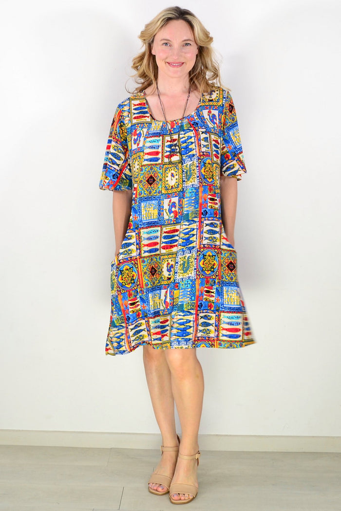 Portuguese short sleeve tunic dress by One Summer, lightweight fabric, casual style, displayed on a hanger against a neutral background.