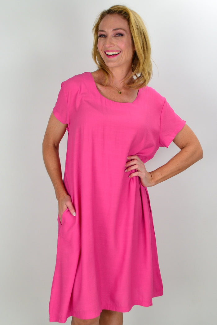 Pink tunic slip dress by I Love Tunics, flowing sleeveless tunic with a soft fabric and relaxed fit, displayed on a hanger.