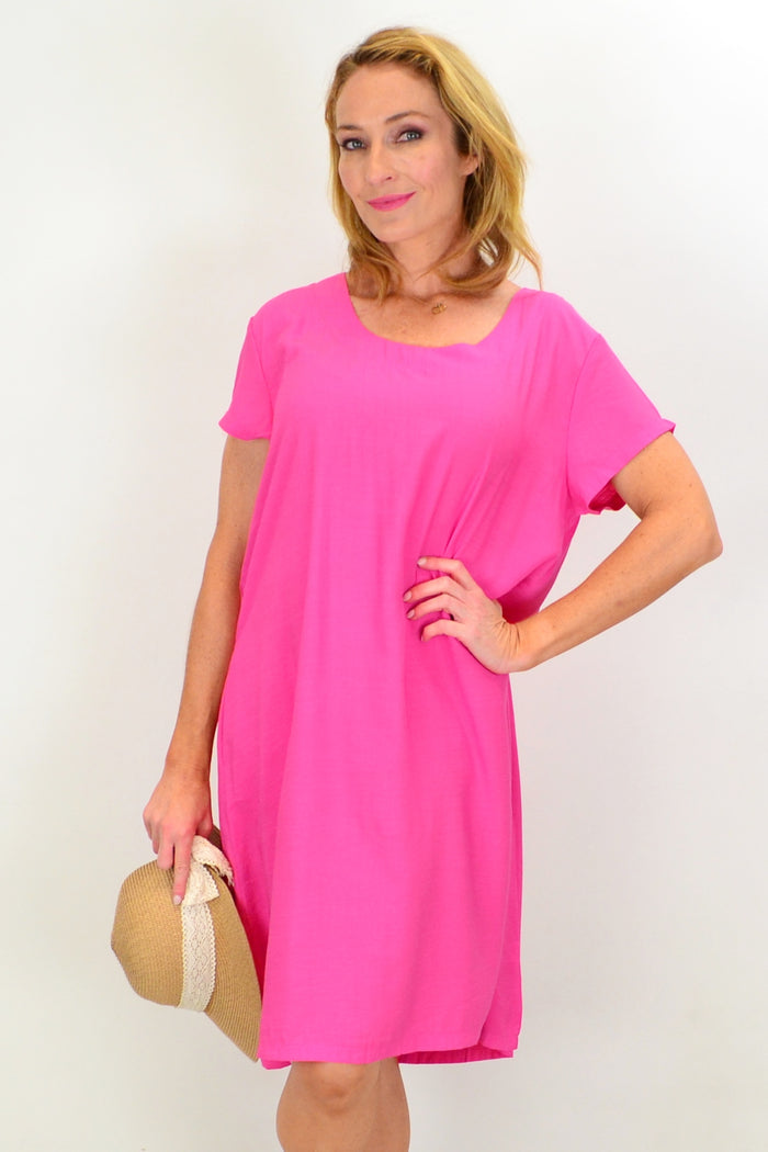 Pink tunic slip dress by I Love Tunics, flowing fabric with a relaxed fit and elegant design, shown on a model.