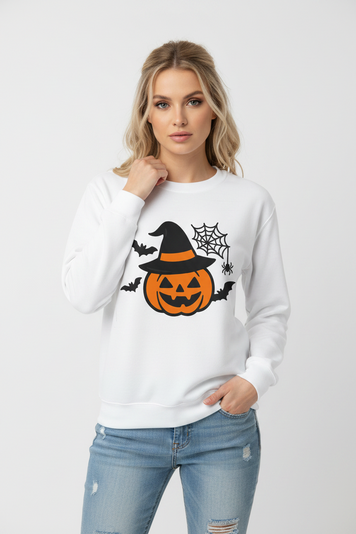 Pumpkin sweatshirt with witch hat graphic in outdoor fall product image showing the relaxed unisex fit for Halloween styling.