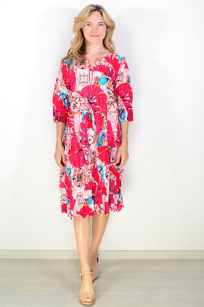 Rebecca Pink Tie Neck Tunic Dress by One Summer, featuring a flowy pink tunic with a tie-neck detail and long sleeves.