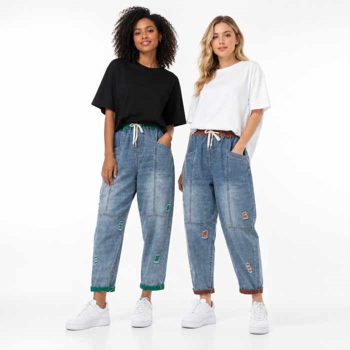 Women's cropped denim pants with clean seam detailing, distressed accents, and practical pockets for daily wear.