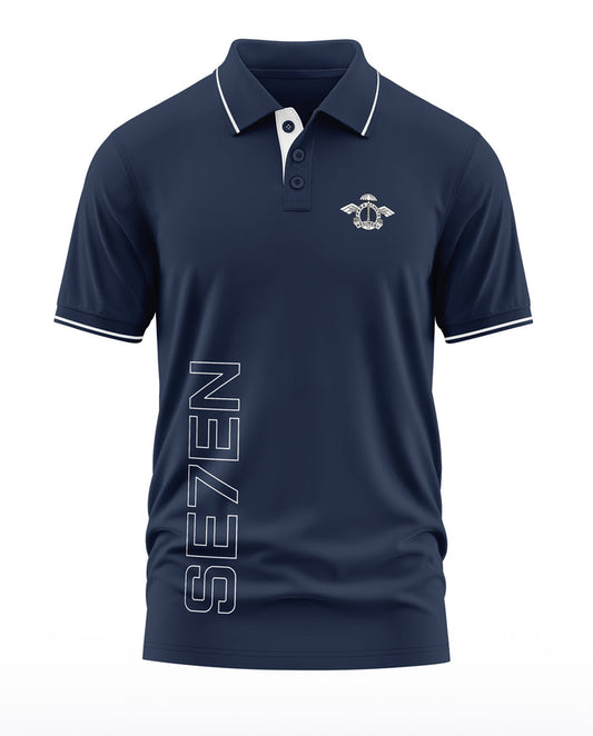 Navy blue men's polo t-shirt with white trim, SE7EN text, and military-inspired chest logo.