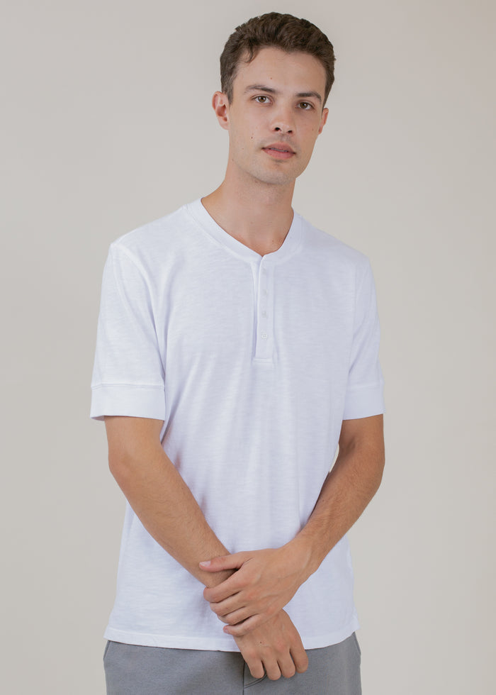 man wearing henley tee in white
