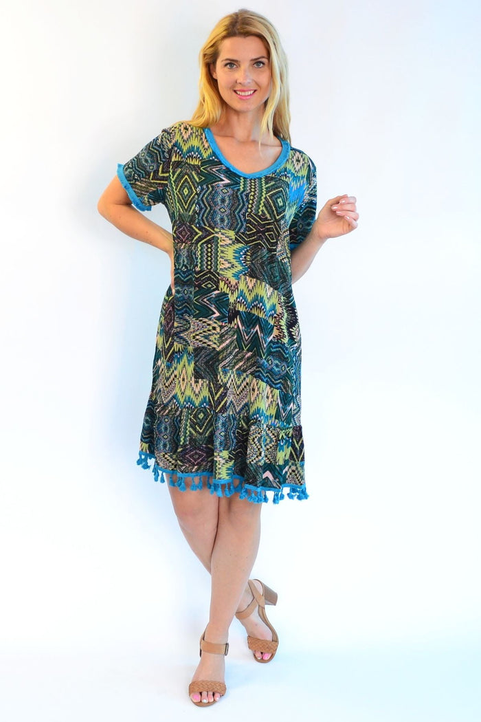 Tasseled Cha Cha Crinkle Tunic Shift Dress by Zen Garden featuring a relaxed fit, crinkle fabric, and decorative tassels.