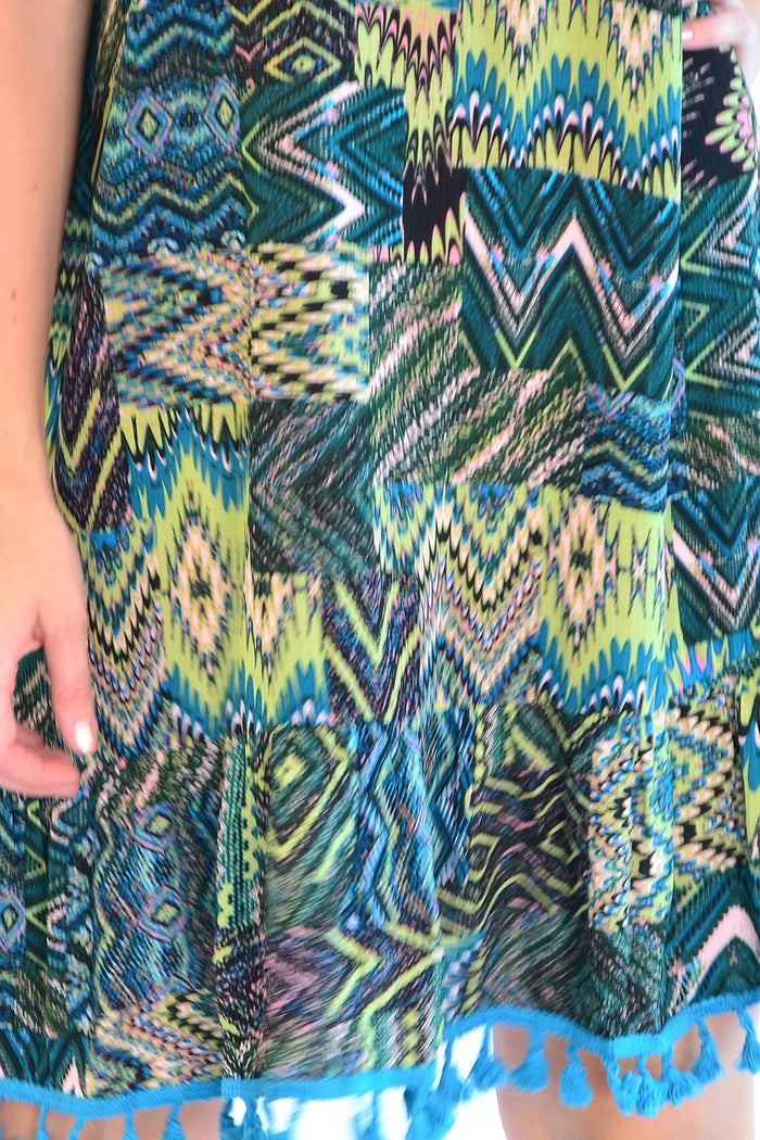Tasseled Cha Cha Crinkle Tunic Shift Dress by Zen Garden featuring a relaxed fit, crinkled fabric, and tassel details.