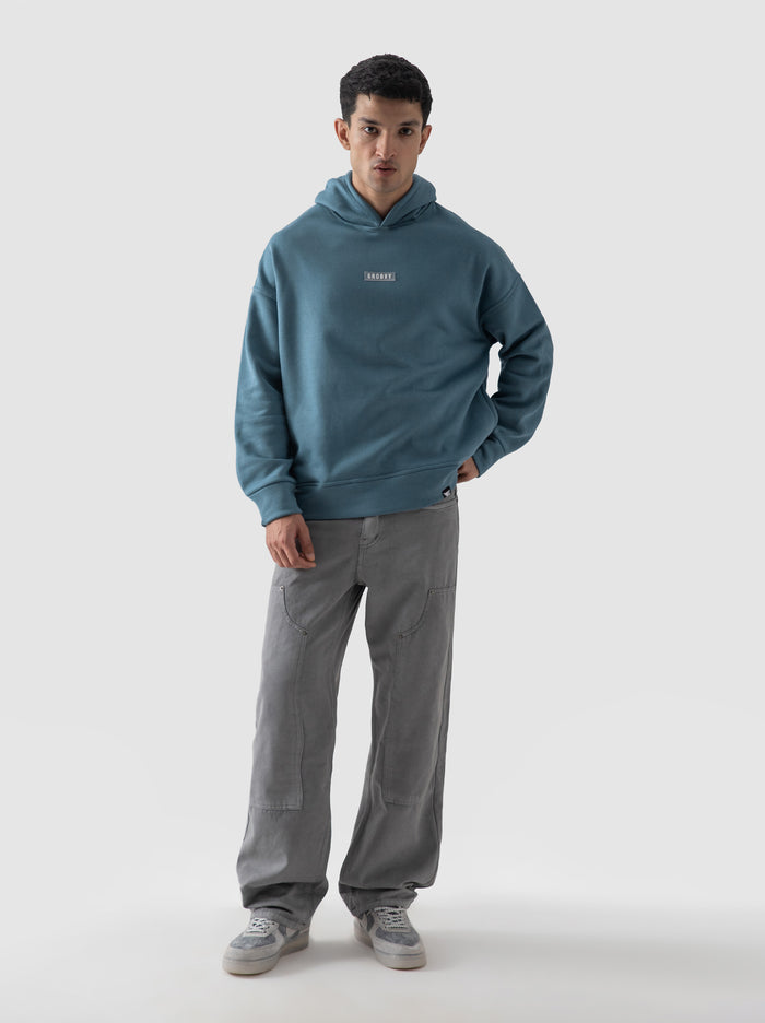 Teal blue oversized hoodie male model full body front view Pakistan – GROOVY