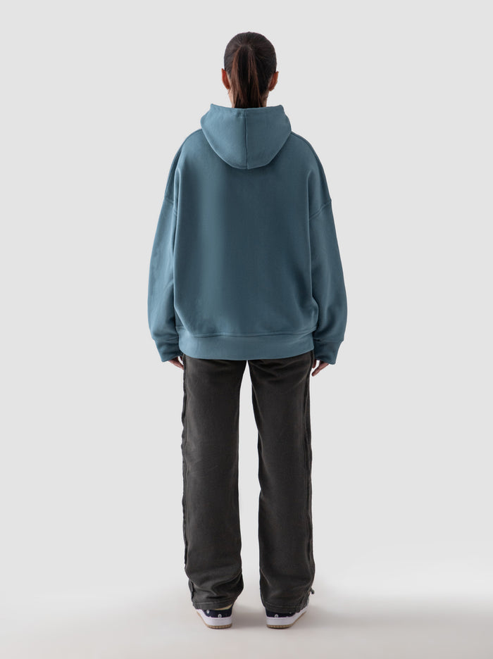 Teal blue oversized hoodie male model side view full body Pakistan – GROOVY