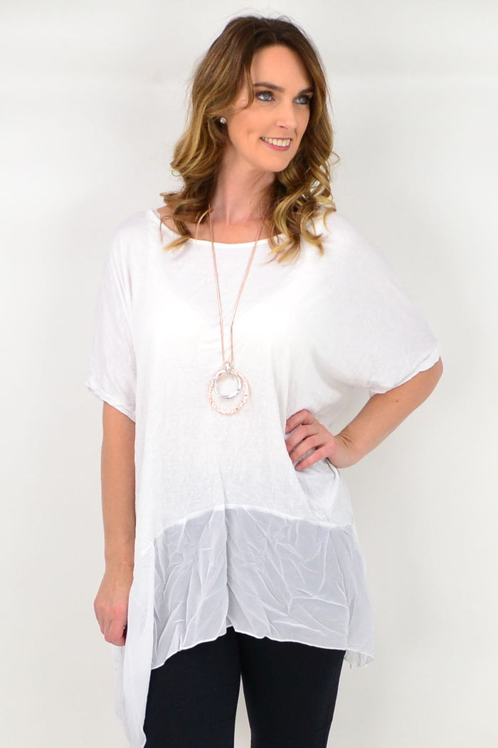 White Heron Island Tunic by I Love Tunics, featuring lightweight fabric and relaxed fit, displayed on a hanger against a neutral background.