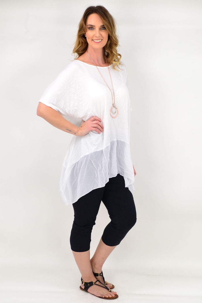 White Heron Island Tunic by I Love Tunics, lightweight and flowy with a relaxed fit, displayed on a hanger.