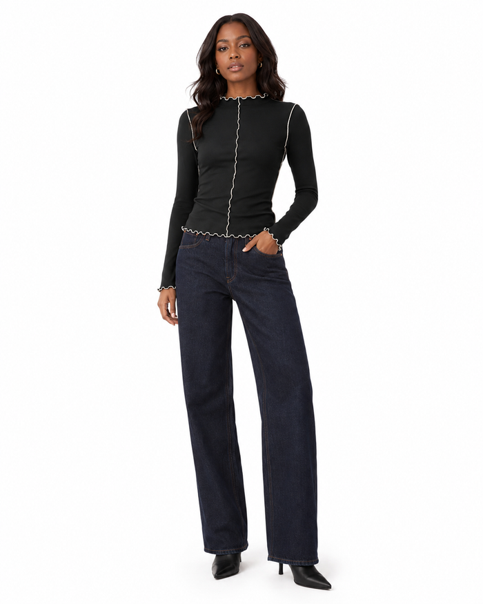 Casual women's mock neck top displayed with long sleeves, a slim fit cut, lettuce trim edging and contrast stitching details.