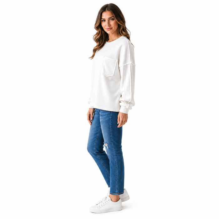 Women's casual office top with pockets, white exposed seam design, relaxed fit and smooth easy-care fabric for daily outfits.